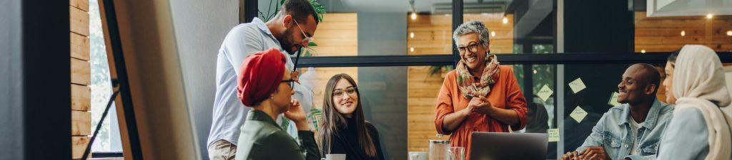 People in office smiling