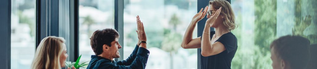 Professional people high fiving